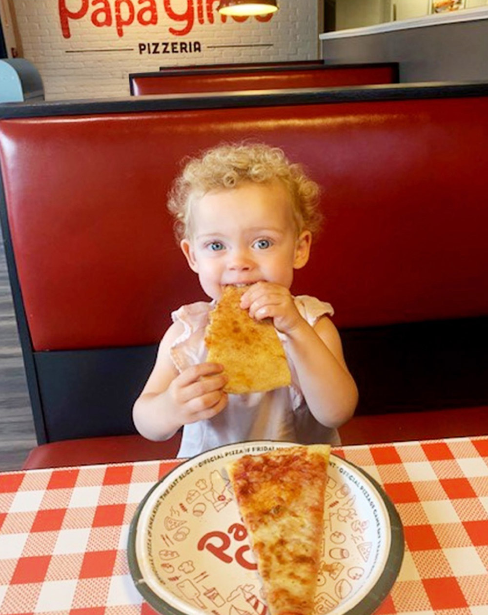 Child enjoying D'Angelo's pizza