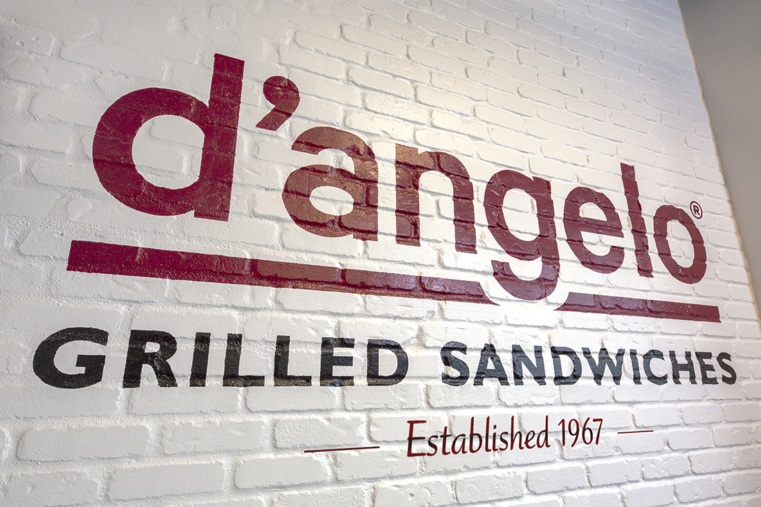 D’Angelo logo on white brick wall